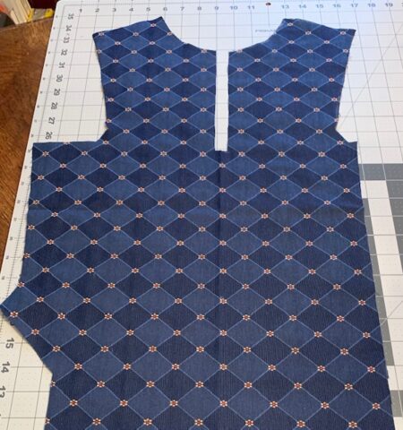 The front panel with left side deep armhole cut