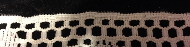 close up of white thread used on lace blending in 
